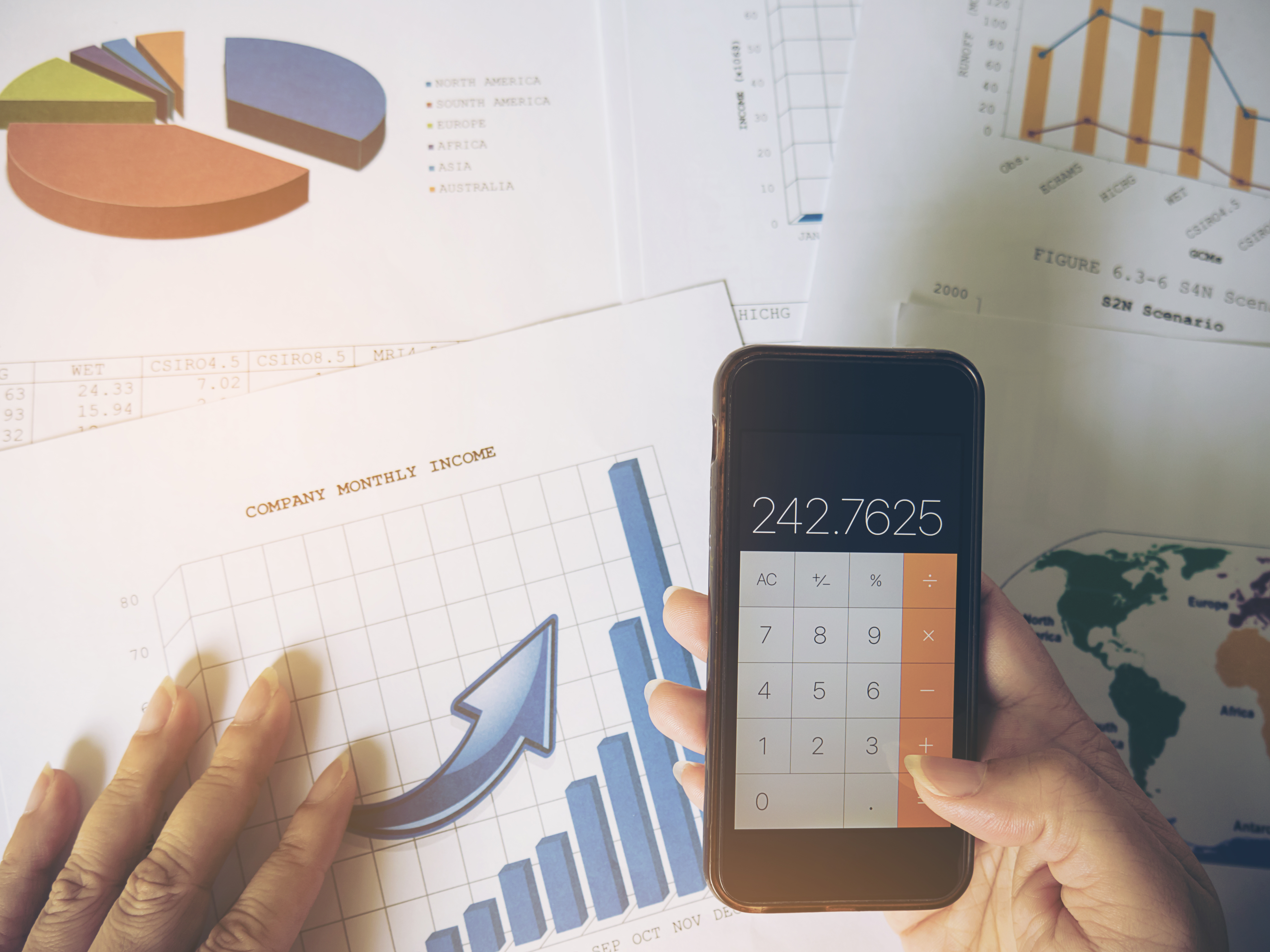 Professional reviewing credit alerts on mobile phone